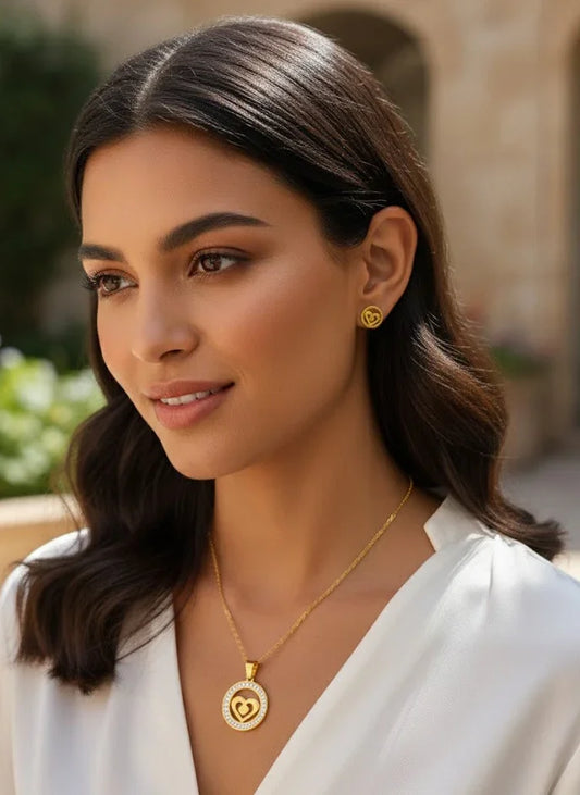 Woman wearing gold jewelry outdoors with blurred background